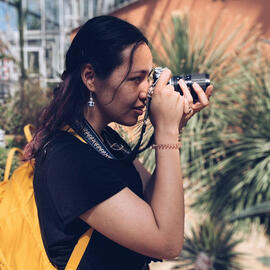 Profile picture of Marichelle Crick. She is holding a camera.